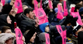 Fans of Everton hold up pink protest banners during their Premier League match against Aston Villa