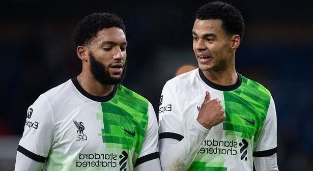 BURNLEY, ENGLAND - DECEMBER 26: Cody Gakpo of Liverpool interacts with team mate Joe Gomez during the Premier League match between Burnley FC and Liverpool FC at Turf Moor on December 26, 2023 in Burnley, England. (Photo by Joe Prior/Visionhaus via Getty Images)