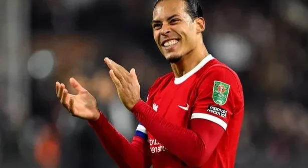 Liverpool defender Virgil van Dijk celebrates after the Reds booked their place in the Carabao Cup final.