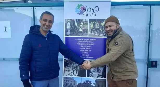 Ibe Hayter (L) of Cycle of Life and Abdul Basit Qadir from Liverpool Muslim Society outside the new bike shelter at Liverpool's Al-Rahma Mosque (Image: Patrick Graham/Liverpool ECHO)