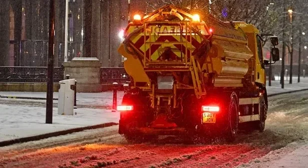 Gritters out as snow falls on the Liverpool waterfront.