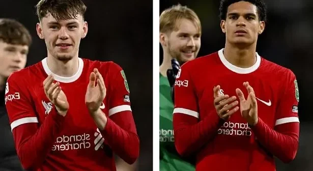 Jarell Quansah and Conor Bradley applaud the travelling Kop after Liverpool reach the Carabao Cup final