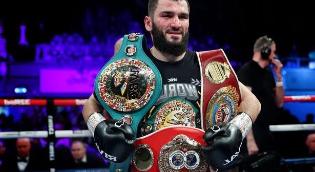 Artur Beterbiev poses for a photograph with their Title Belts after defeating Anthony Yarde