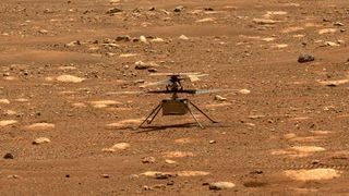 NASA's Mars Helicopter Ingenuity is seen on the rocky red surface of Mars.