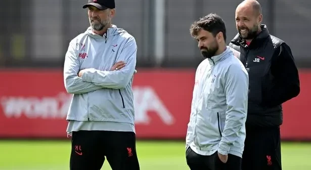 Jurgen Klopp manager of Liverpool Vitor Matos elite development coach of Liverpool and Barry Lewtas Liverpool Under 21's head coach during a training session at AXA Training Centre