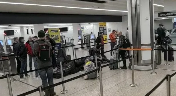 Anxious passengers queue at Birmingham airport