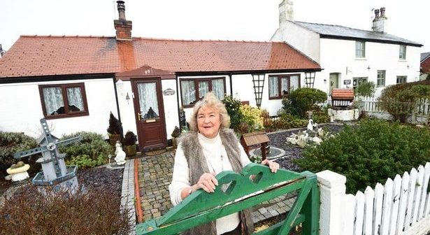 Mary Porter has lived in one of the shrimper's cottages for the last 20 years