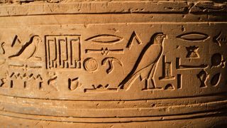 Sand stone carving of egyptian god and goddess at Temple of kom ombo locate at North aswan city Egypt.