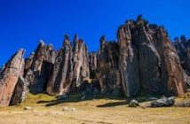 photo of towering stone features in peru called the Huayllay Stone Forest against a clear blue sky